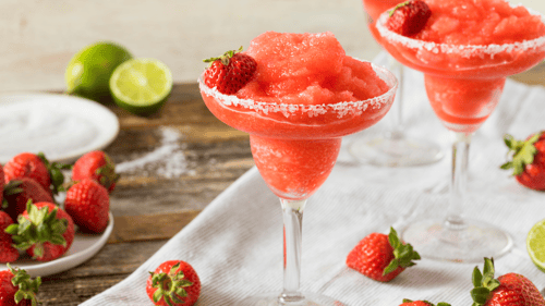 frozen strawberry daiquiris on a table