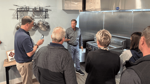 Five customers stand in front of Lindox Siegel team member doing training on Royal filtration