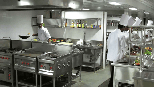 Commercial kitchen with chefs working