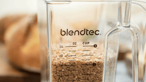 Blendtec container half full with grain